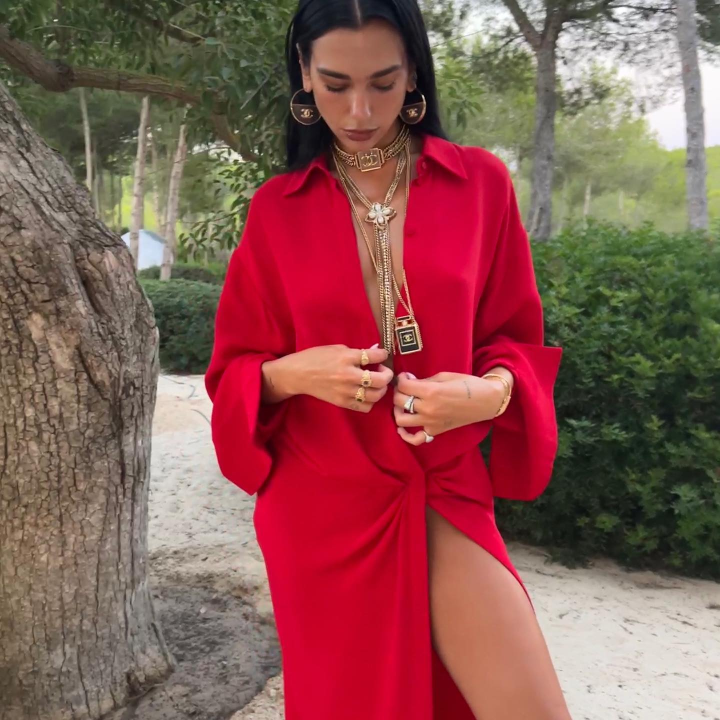The popstar donned a red blazer dress with chunky Chanel necklaces