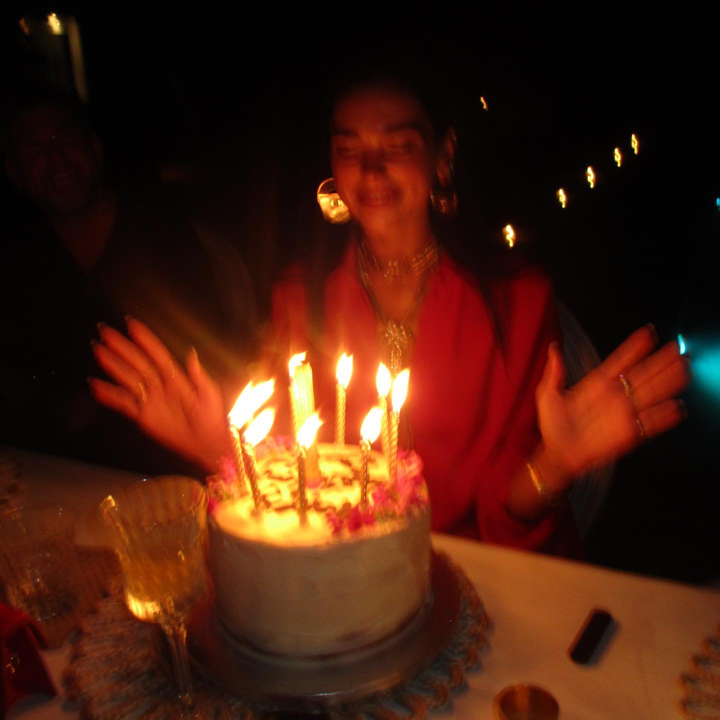 She beamed as the candles on her cake were lit